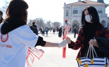 Women were greeted with carnations in the squares